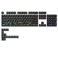 Black keyboard keycaps set with colorful cloud and star patterns, scattered layout on white background